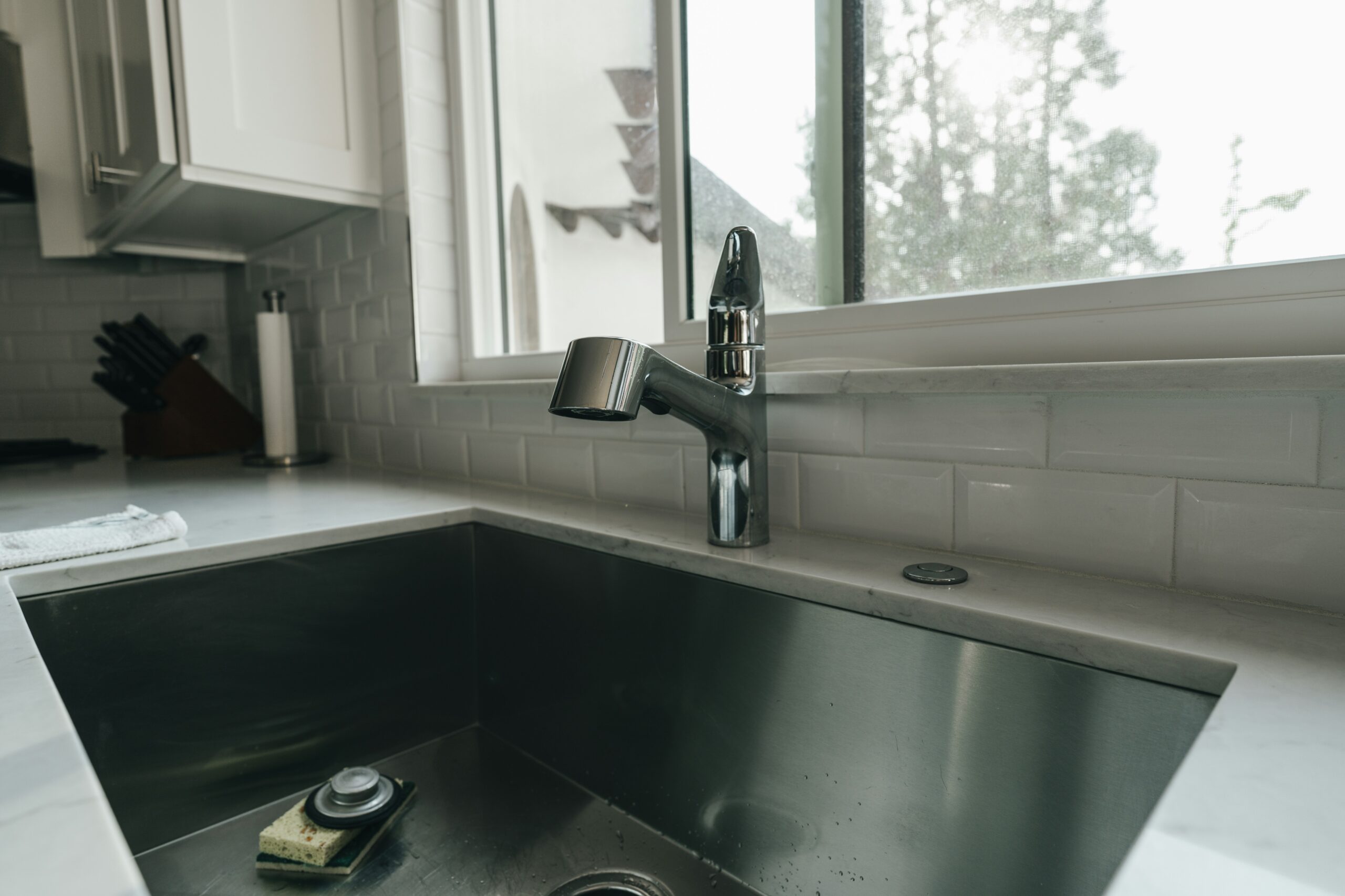 a kitchen sink with a window
